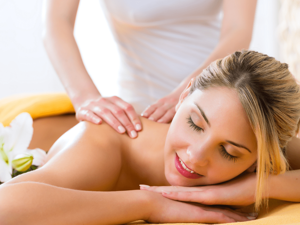 woman being relaxed doring a massage with hands